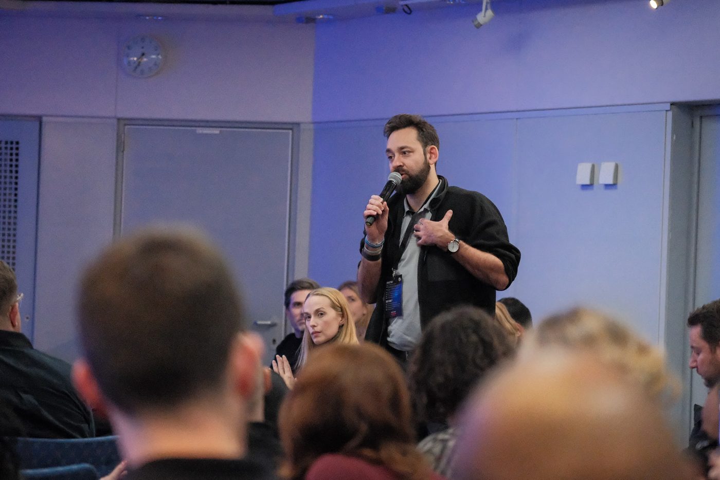 Yoann speaking with a microphone at a founder event